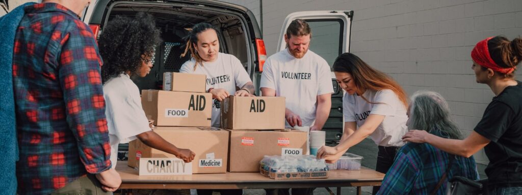 A Volunteer People Helping Others with food aid